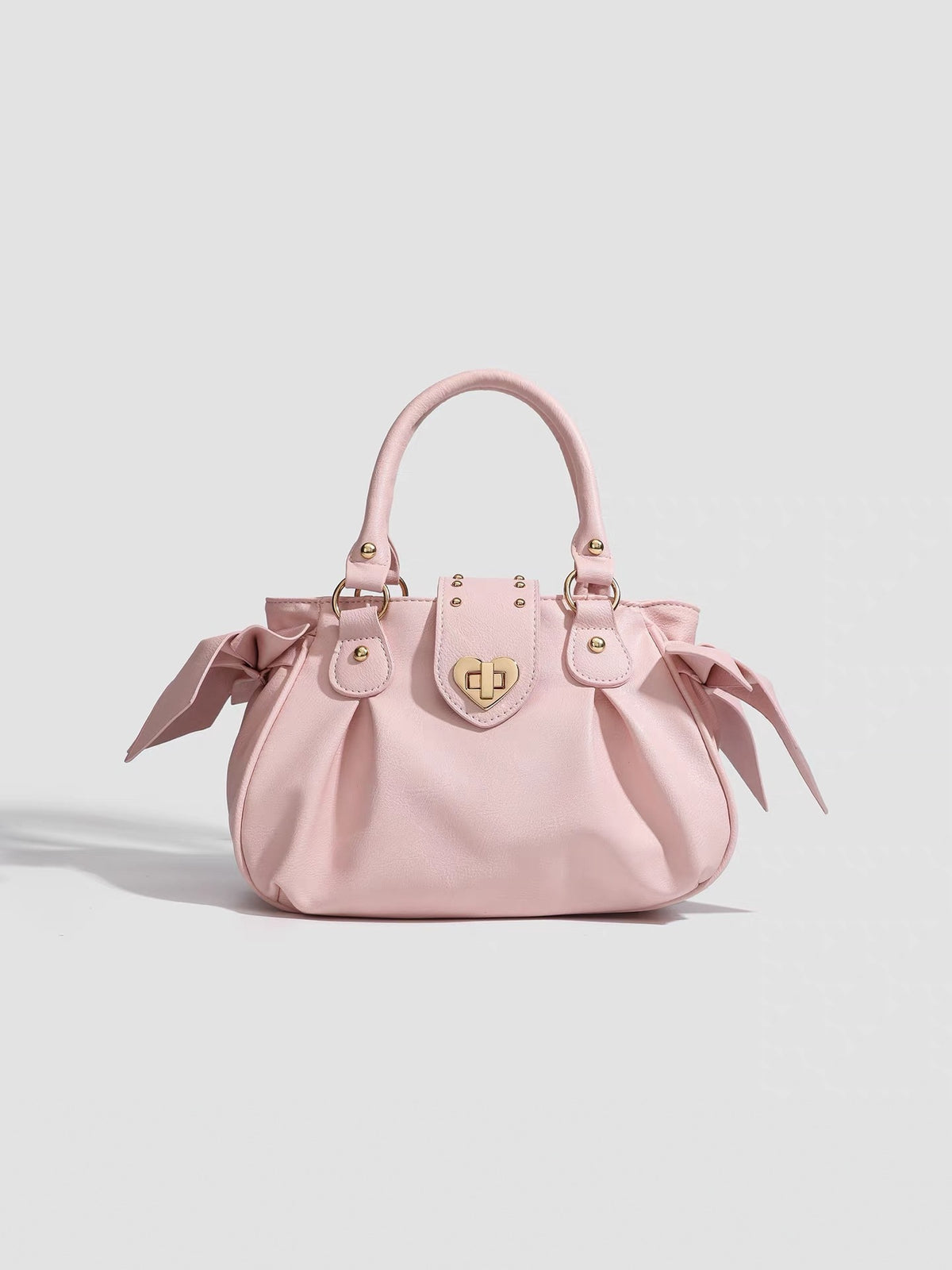 Pink pleated handbag