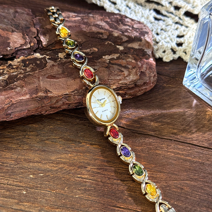 Oval watch with gemstones and diamonds