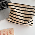 Knitted striped makeup bag