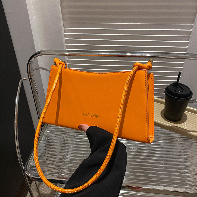 Candy-colored underarm bag