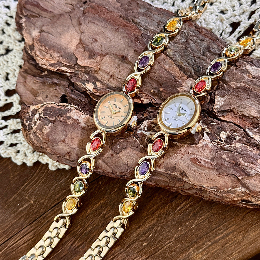 Oval watch with gemstones and diamonds
