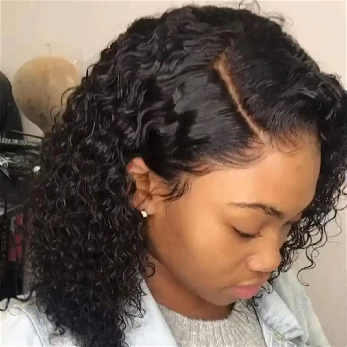 Black mid-part short curly hair