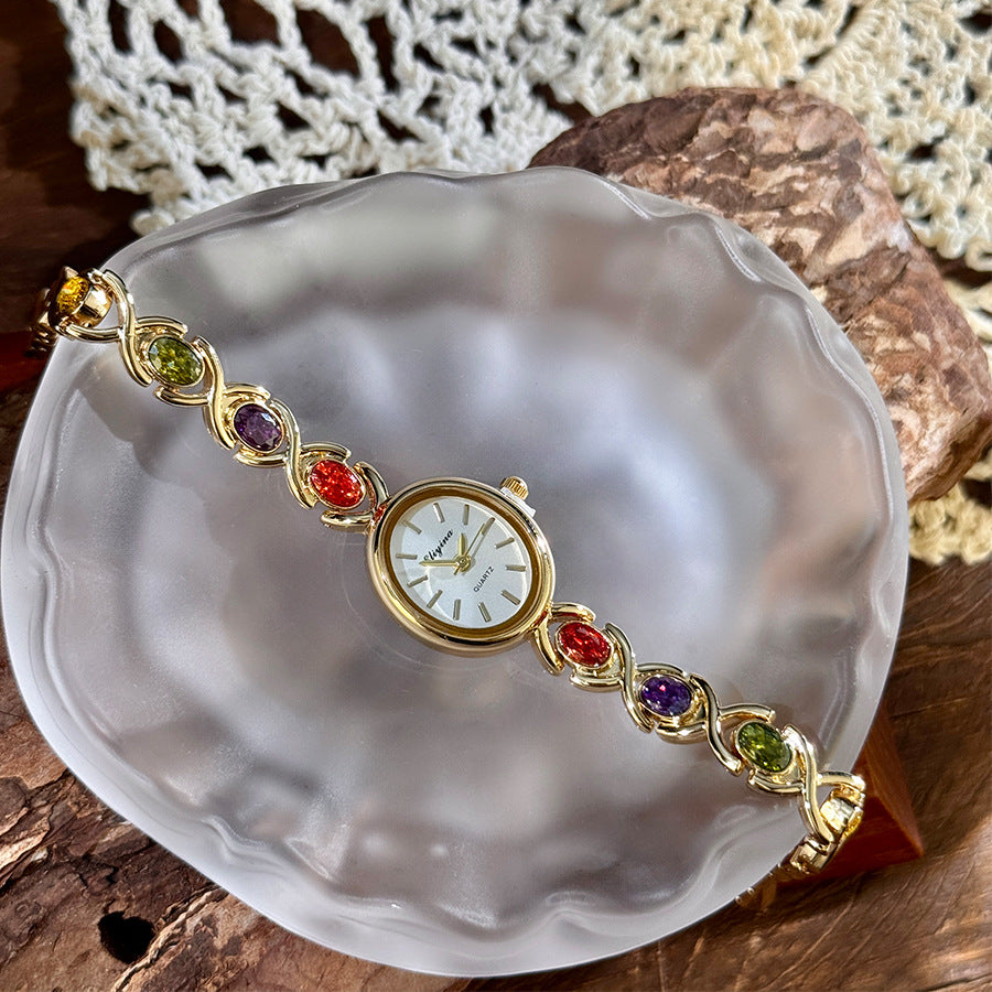 Oval watch with gemstones and diamonds